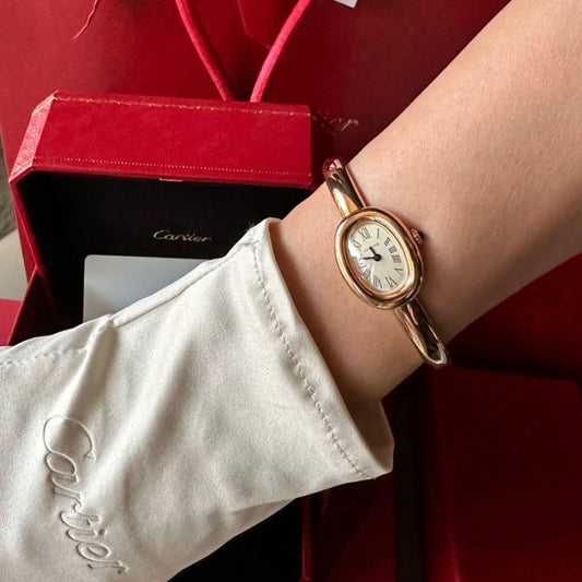 How to Style a Gold Bangle Watch with an Oval Face