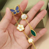 Lucky Butterfly & Clover Charm Bracelet – Gold-Tone Multi-Stone Bracelet