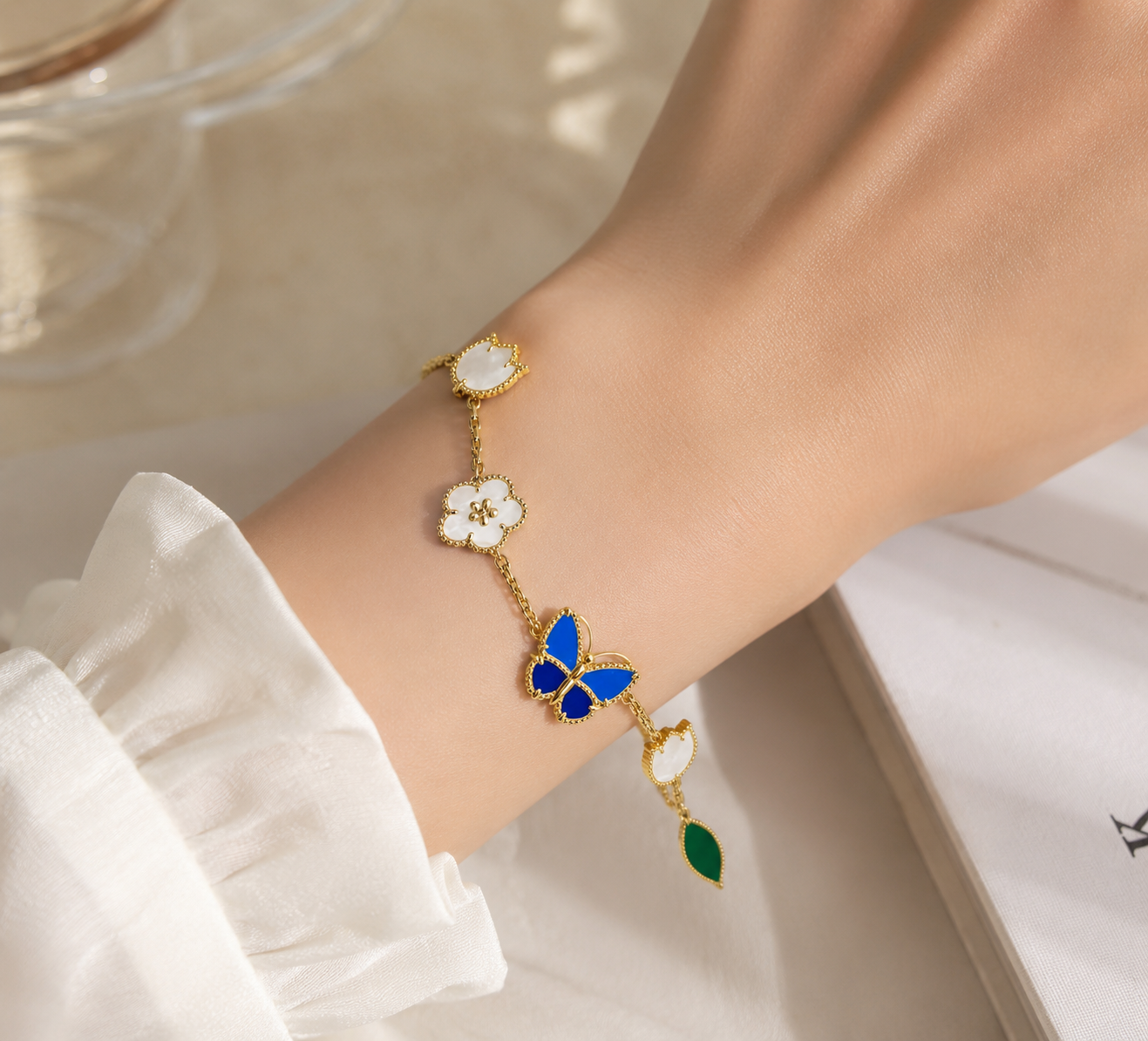 Lucky Butterfly & Clover Charm Bracelet – Gold-Tone Multi-Stone Bracelet