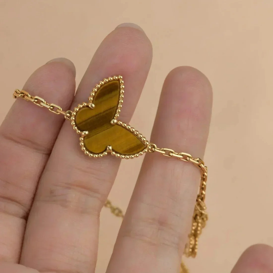 Lucky Butterfly & Clover Charm Bracelet – Gold-Tone Multi-Stone Bracelet